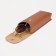 A case for glasses on the button, brown color