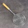 A colander-sytoos with a wooden handle 44cm, diameter18cm, depth 6.5cm