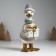 Polystone souvenir "Goose in a beige sweater, with a gift" 9.5x12x22.5 cm