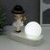 Souvenir Polystone Light "Baby in a black hat, with a gold bubble at the ball" 16.5x8x16 cm