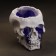 Figure candle in concrete "Crying skull", purple