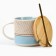 Ceramic mug with a lid and spoon "Geometry", 470 ml, beige color