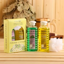 A set of shampoos with a white washcloth 