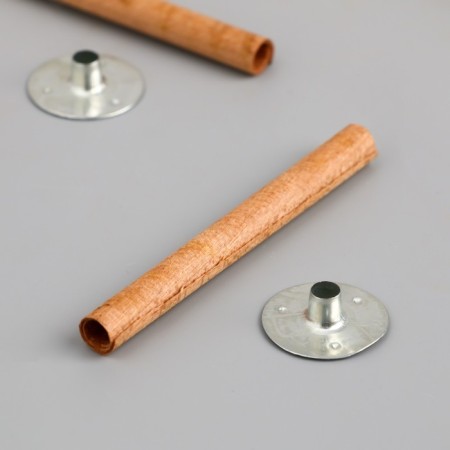 A candle wick with a metal holder is a round 0.6x6.5 cm-1