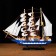 The ship souvenir medium "Spanola", the sides of white and blue, white sails, 43x39 x 9 cm