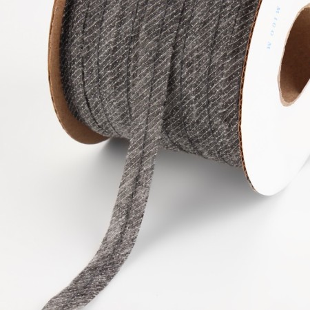 Non -woven ribbon, threaded, reinforced, 12 mm, 100 m, gray color.