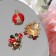 Brooch "God's Layer" form mix, red-black color in gold (indivisible packing 12 pcs., Price per pcs.)