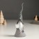 Polystone souvenir "Santa Claus in a gray outfit and a long cap, with a gift" 6.2x5.2x18 cm
