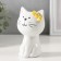 Souvenir Ceramics "White cat with yellow flowers on the ear, sits" 7.2x6.5x10.3 cm