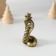 Polystone souvenir "Cobra in the cylinder" Black-gold 3.6x6 cm