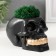 Concrete Kashpo "Skull Money" with moss 7x11 cm black with golden teeth (moss green stabil)
