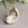 Polystone souvenir "Baby sleeping in the wing" White 8.7x6x5.5 cm
