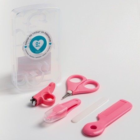 A child’s care set, 5 items (comb, tweezers, scissors, a knipser, saw), pink color