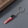 Acryl key a mirror "bloodied saw" 5.1x1.3x0.3 cm