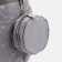 A backpack with a zipper, an outer pocket, 2 lateral pockets, a wallet, color gray color