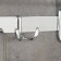 The shelf is hinged with a holder of towels, 4 double hooks, 59.5 × 26 × 14 cm, color chromium