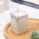 Candle "Square" in a candlestick of gypsum, 5x6cm, marble with purple strips