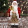 Santa Claus "in a golden red suit, with a strap, with gifts" 15x30 cm