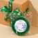 A satin ribbon "Round dance of snowflakes", green, 2 cm x 22.5 m
