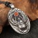 Scarabian amulet with a carbonic stone, 30x47 mm, metallic