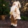 Santa Claus "in a fluffy fur coat, cap, with a gift" 47 cm, white-golden