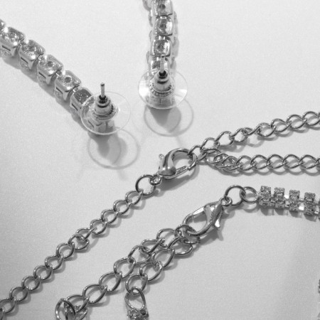 Set 4 objects: earrings, necklaces, bracelet, ovala ovals ring, white color in silver-1