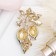Brooch "gooseberries", green color in gold