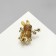 Brooch "Rabbit" with flowers, colored in gold