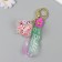 A plastic keychain with a carbine, a strap "Flying Bandage" Water with decor1.8x5.3x5.6 cm