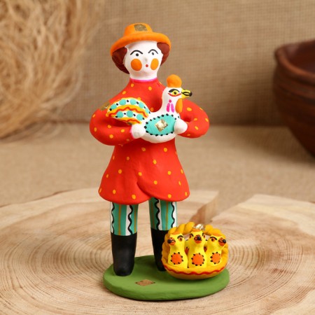 Dymkovo toy "Standing man with a chicken"