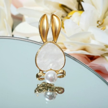 Broach "Bunny" with a bow, the color is white in matte gold