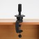 The tripod is a desktop for a training head, black