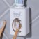 Mechanical “butterfly” toothpaste dispenser, 9.5 x 5.8 cm.