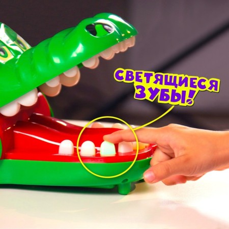 A board game to dexterity and reaction "faster than a crocodile", from 2 players, 4+-6
