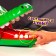 A board game to dexterity and reaction "faster than a crocodile", from 2 players, 4+