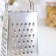 A heap with a doser lid and a side for cheese, a metal pen, color mix