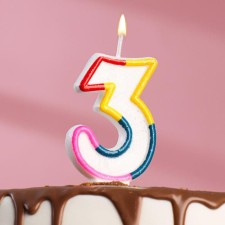 A candle for a cake with sparkles 