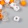 Plastic beads "Crystal polyhedron. Orange, white, transparent" set 30 g 1x1x1 cm