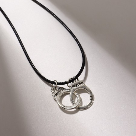 Piece on the cord "handcuffs", color black silver on a black lace, 42 cm-1