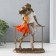 Polystone souvenir "Kiss on the bridge" of bronze, orange-white 17x8x25 cm