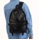 City backpack on a zipper, black color