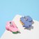 Earrings plastic "goodies" dinosaur and flower, the color of the blue pink