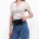 Female belt bag on the button, black color