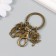Trick Metal with carbine "Eagle and Flower" Bronze 6 cm