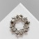 Brooch "Flowers" in a wreath, the color is white in matte silver