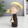 Souvenir Polystone "A boy in a gold baseball cap with a rose and gold bubble" 12x6x8 cm