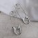 Earrings of the Modern pins, silver color