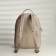 A backpack with a zipper, Textura, external pocket, light-beige color