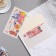 Money envelope "Congratulations!" glasses, roses,