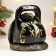 The piggy bank "Snake with weights" is black, 25 cm